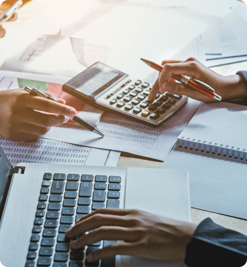 Image of a calculator and laptop meeting